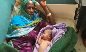 Zahra Zakaria was in labour for three days in a tent in West Darfur. A Caesarean section saved her and her son. © UNFPA