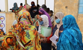 Members of a UNFPA-supported community network in Sudan speak to women in about the dangers of female genital mutilation. © UNFP