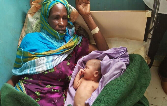 Zahra Zakaria was in labour for three days in a tent in West Darfur. A Caesarean section saved her and her son. © UNFPA