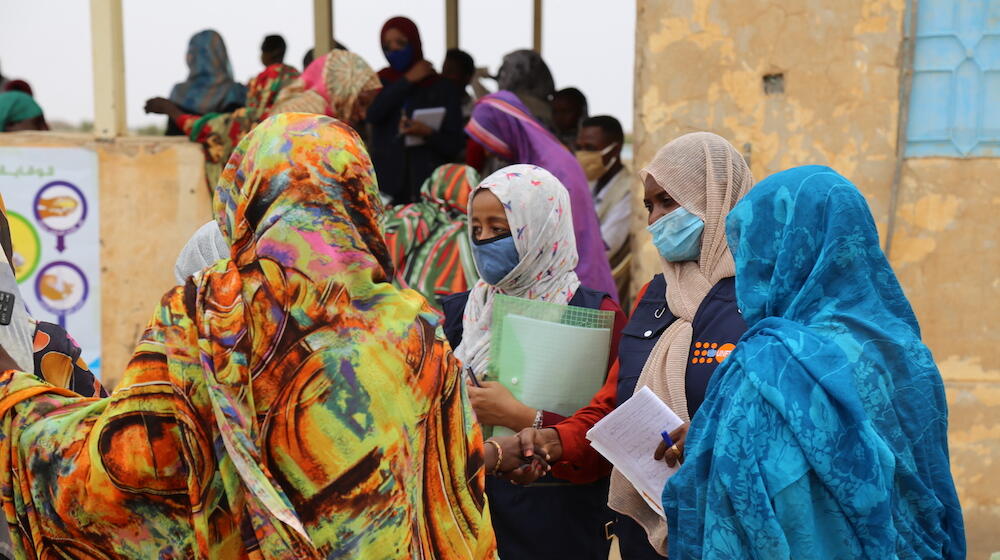 Members of a UNFPA-supported community network in Sudan speak to women in about the dangers of female genital mutilation. © UNFP